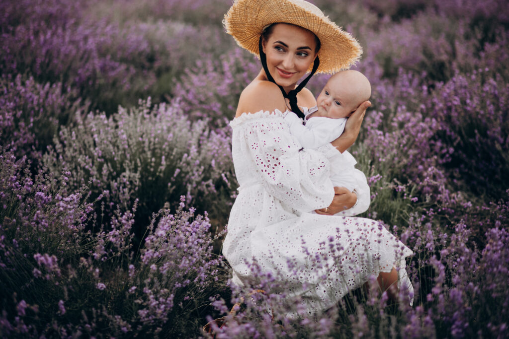 woman with baby son in a lavander field